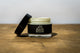 Muscle Butter USA recovery balm jar with lid removed showing cream texture